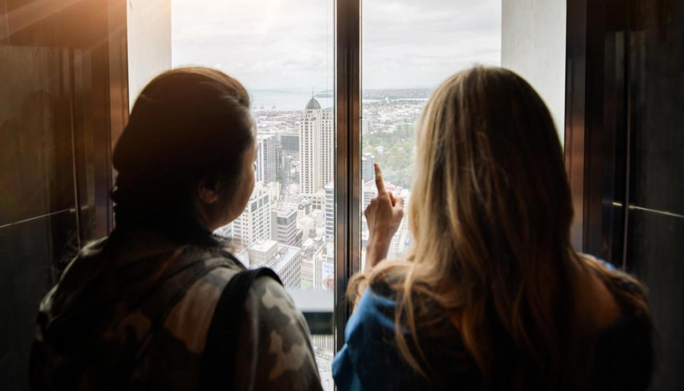 Glass fronted elevators taking guests up to the observation levels